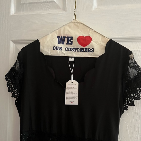 Black dress. new. size small. The waist has a see through pattern. - Picture 2 of 3